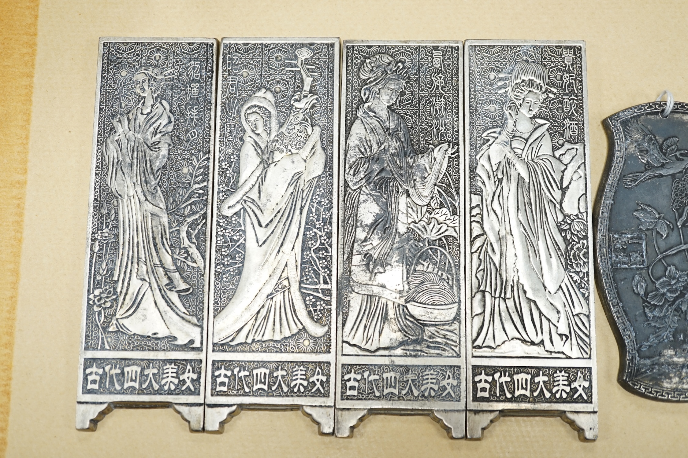 Five Chinese metal embossed figural plaques, four plaques 15cm high. Condition - three tarnished